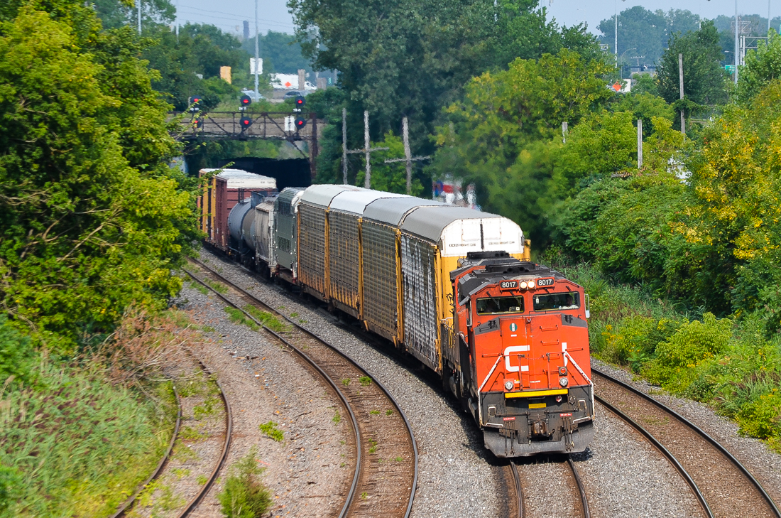 CN 401 heads west through Montreal West, led by CN 8017 (missing part of its nose noodle) and CN 9450. Five cars back from the head end is a Bombardier Multilevel car destined for New Jersey Transit. It will be interchanged to CP at Montreal for furtherance to the Bombardier plant in Plattsburgh, NY. For more train photos, check out http://www.flickr.com/photos/mtlwestrailfan/