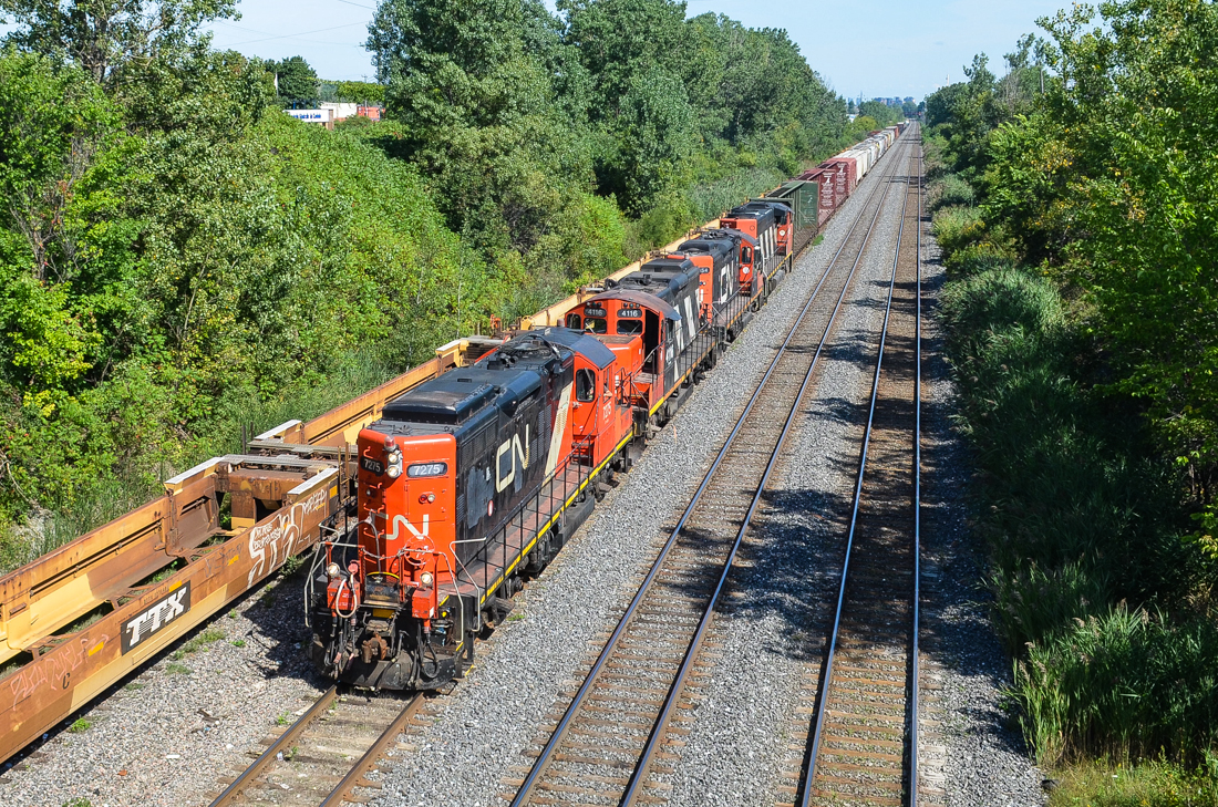 Long hood forward... CN 7275, CN 4116, CN 7054 & CN 9486 are in charge of CN 527, a local Montreal transfer heading west towards Taschereau Yard. This transfer always has anywhere from 3-5 geeps. For more train photos, check out http://www.flickr.com/photos/mtlwestrailfan/