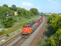 CN 527 head towards Taschereau Yard with three geeps. Lashup was CN 9486, CN 7054 & CN 4116. For more train photos, check out http://www.flickr.com/photos/mtlwestrailfan/