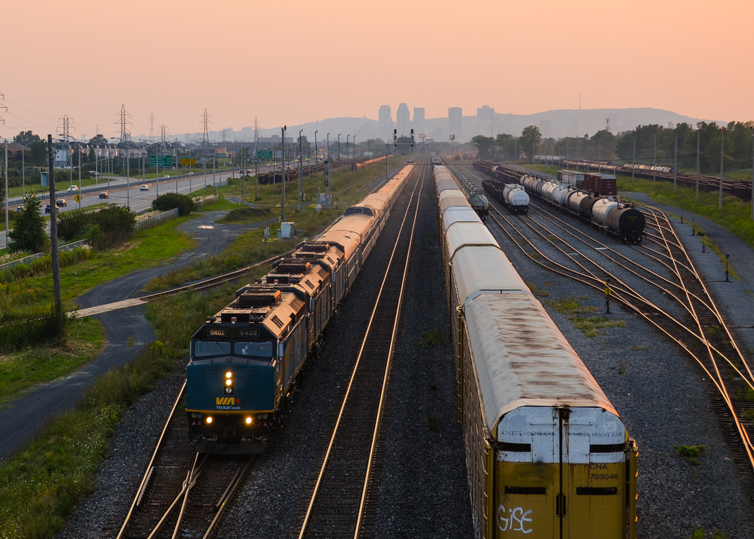 Sunset at Southwark. The combined VIA Rail Ocean/Chaleur is passing through Southwark Yard at sunset, with downtown Montreal's skyline barely visible in the distance. At right is CN 309, stopped to set out some TankTrain cars. This is a very long consist, with three F40's, five ex-CP stainless steel cars (the Chaleur section of the train), about 17 Renaissance cars and an ex-CP Park car bringing up the rear. With the Chaleur being cancelled, this train is shorter at present time. For more train photos, check out http://www.flickr.com/photos/mtlwestrailfan/