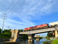 This CP train is crossing the Rockfield Bridge over the Lachine Canal. It is led by CP 8727 & CP 8779 and is composed of mostly empty tank cars.