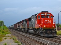 CN U700 with 96 loaded crude oil cars and two buffers cars heads east through Dorval with CN 5403, CN 2098 & CN 8919 at the head end. There was no DPU. This train originated on BNSF in North Dakota and is headed to Ultramar in St-Romuald, Quebec (near Quebec City). CN 5403 was originally Oakway 9028 and CN 2098 was originally ATSF 865.