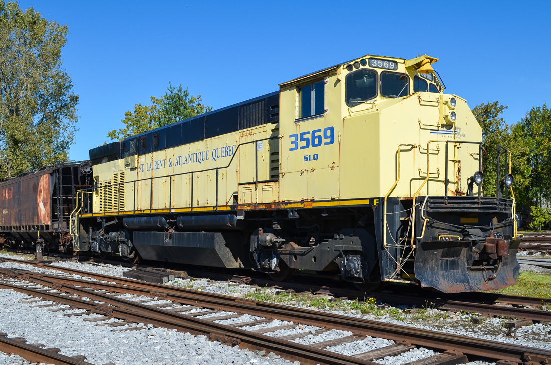 SLQ 3569 was built as CN 2569 by Montreal Locomotive Works in 1976 and renumbered to CN 3569 in 1987. It was sold to the St. Lawrence & Atlantic where it kept the same number and they donated it to Exporail where it now resides. For more train photos, check out http://www.flickr.com/photos/mtlwestrailfan/