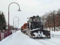 CP 5788, CP 5926 (both SD40-2's) & Jordan Spreader CP 402893 are about to tie up in front of the Montreal West station for a lunch break after plowing the Westmount Sub after some heavy snowfall. For more train photos, check out http://www.flickr.com/photos/mtlwestrailfan/