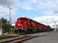 While the tracks and the equipment is CP, this is a Quebec-Gatineau windmill train with a Quebec-Gatineau crew. It is on its way to St-Luc Yard and is crossing Wilderton Avenue. Power is three 'resurrected' ex-SOO units: CP 6262, CP 6251 & CP 6247.