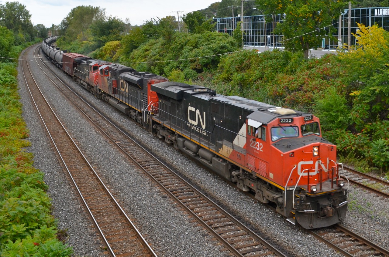 CN 710 is a loaded oil train destined for the Ultramar refinery at St-Romuald, Qc (near Quebec City). It had 99 tank cars and a buffer car today. Power was CN 2232, CN 8947 & CN 2513.