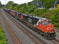 CN 710 is a loaded oil train destined for the Ultramar refinery at St-Romuald, Qc (near Quebec City). It had 99 tank cars and a buffer car today. Power was CN 2232, CN 8947 & CN 2513.