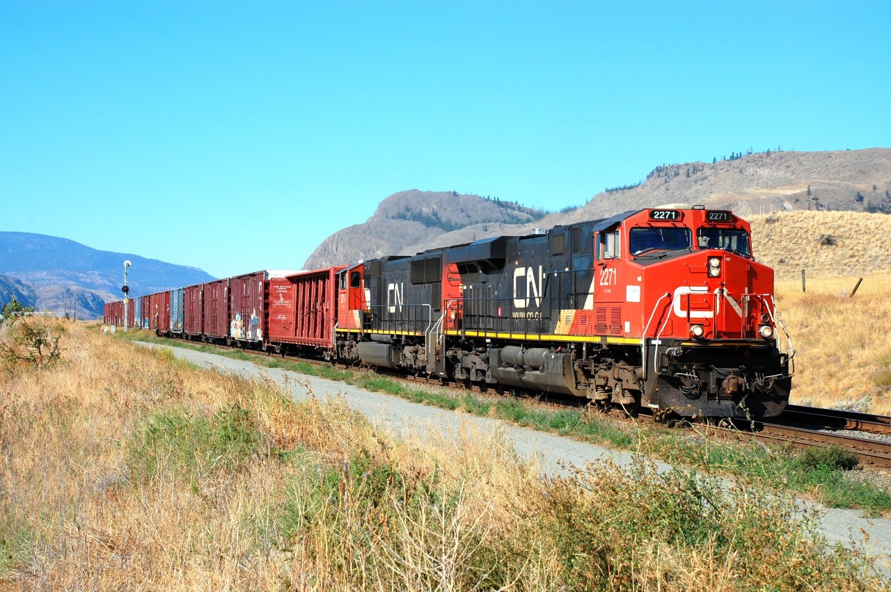 CN nos.2271&5714 are recovering from a signal stop just east of Kissick on the Ashcroft sub and are headed for Kamloops with a mixed freight.