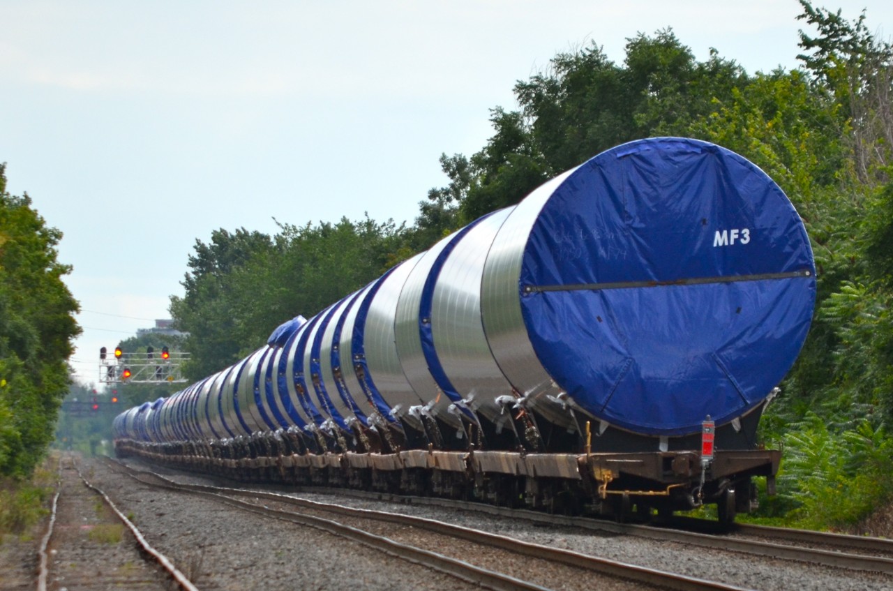 While the tracks and the equipment is CP, this is a Quebec-Gatineau windmill train with a Quebec-Gatineau crew. It is on its way to St-Luc Yard. Power is three 'resurrected' ex-SOO units: CP 6262, CP 6251 & CP 6247.