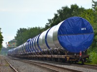 While the tracks and the equipment is CP, this is a Quebec-Gatineau windmill train with a Quebec-Gatineau crew. It is on its way to St-Luc Yard. Power is three 'resurrected' ex-SOO units: CP 6262, CP 6251 & CP 6247.