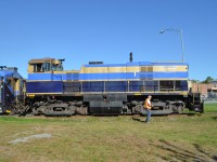 While the rest of the train is still crossing rue principale in Magog, a crewmember moves ahead to throw the switch for the siding in Magog, will the train will stop for a half hour layover. The consist was OEX 26 (MLW M420TR), two RDC's sandwiching a dome car and FLNX 484 (EMD FL9). For more train photos, check out http://www.flickr.com/photos/mtlwestrailfan/ 