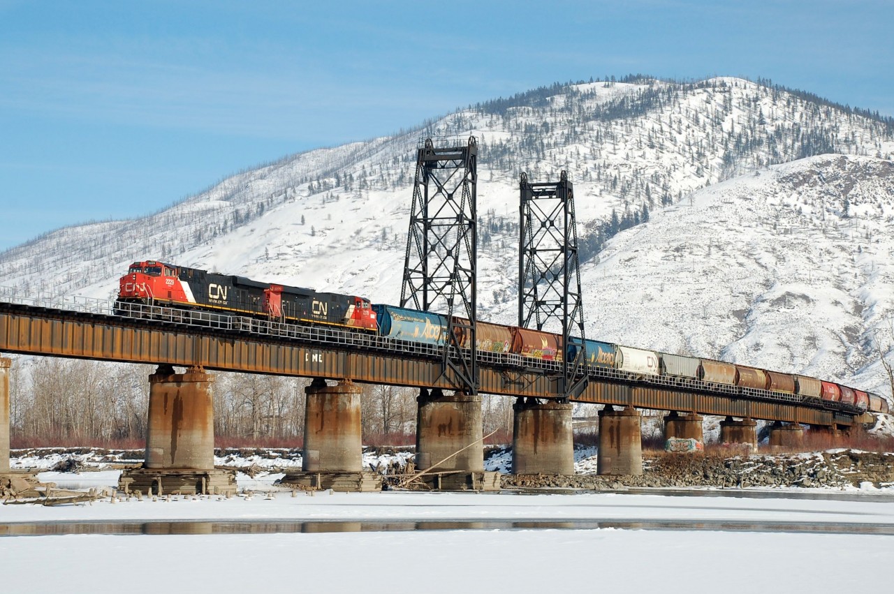 CN nos.2229&2270 are crossing the North Thompson River in Kamloops at the head of a westbound grain train.
