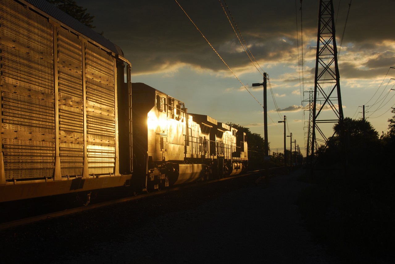 Just a lucky photo. Thought the sun was just right, even though it's GE its still a good shot. Take notice the power poles running along side the tracks with lights and cameras for security for the tunnel.