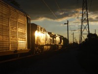 Just a lucky photo. Thought the sun was just right, even though it's GE its still a good shot. Take notice the power poles running along side the tracks with lights and cameras for security for the tunnel.