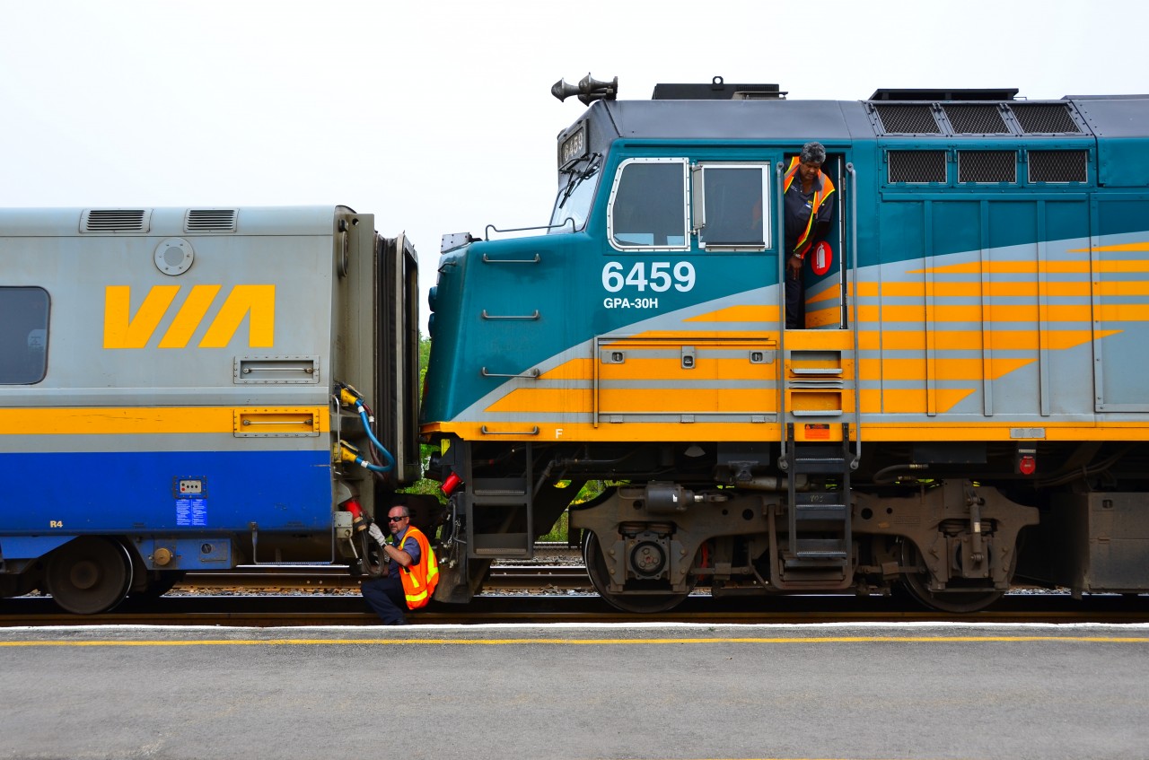 VIA Rail trains 52 and 50 operate joined from Toronto to Brockville. They usually are separated at Manitoba yard, west of Brockville Station, but today they are being split at the station. #52 (the front) does not pick up passengers at Brockville. It is due in Montréal at 11:55. #50 (the rear) picks up riders at Brockville and travels via Ottawa, where it is due at 11:12, to Montréal, which it is scheduled to reach at 13:18.