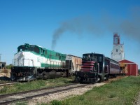 GWRS 2000 pulls loads from the elevator at Ogema past the Southern Prairie Railway shop track.