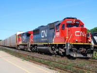 CN 148 is slowing down to cross over at Masseys to get out of the way of 331 coming westbound on the north track.