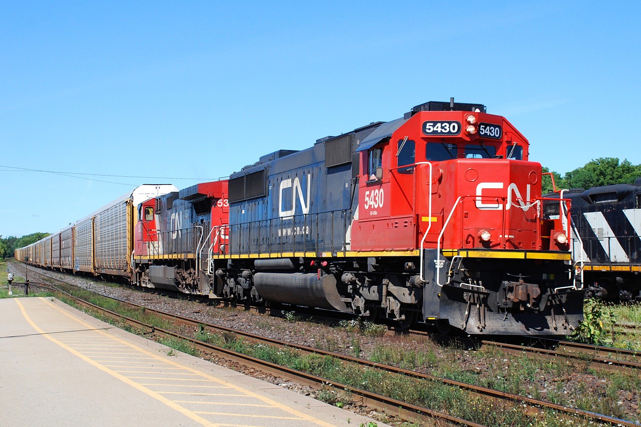 CN 148 is slowing down to cross over at Masseys to get out of the way of 331 coming westbound on the north track.