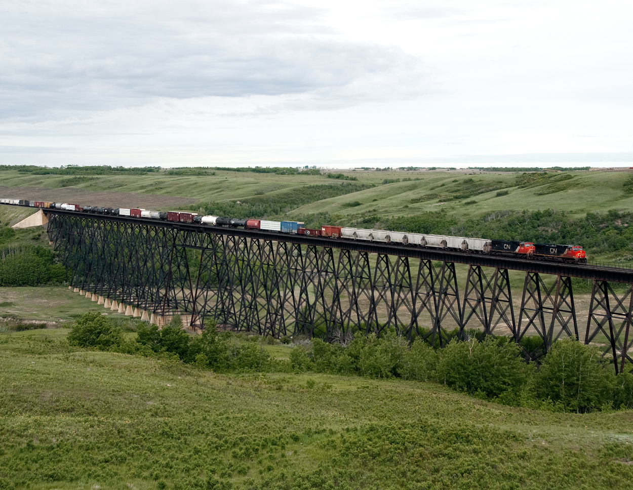 Eastbound mixed freight 312 crosses the Battle River west of Wainwright