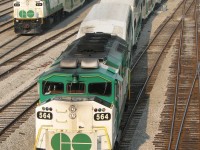 Back when the F59PH ruled GO Transit, there was no sleek new MP40PH-3C, no rush to shoot the entire 45 unit F59 fleet, nor was there actually any excitement in shooting one: they were on everything. On this sunny May day back in 2007, we find the carefully executed ballet of train movements in and out of Union Station at Bathurst St., with each one sporting an F59. GO 564 arrives inbound on Milton line train #156, while 534 departs for Willowbrook with Lakeshore line equipment move 472. In the background on the bypass tracks, 543 also waits to head to Willowbrook with equipment from Milton line train 152.
<br><br>
A year later, the new MP40's would be making inroads on many of these trains. 5 years later, and one would actually be excited to catch one of the 8 remaining F59's amidst the fleet of 57 new MP40's. The torch has been passed, but the ballet at Bathurst Street continues.