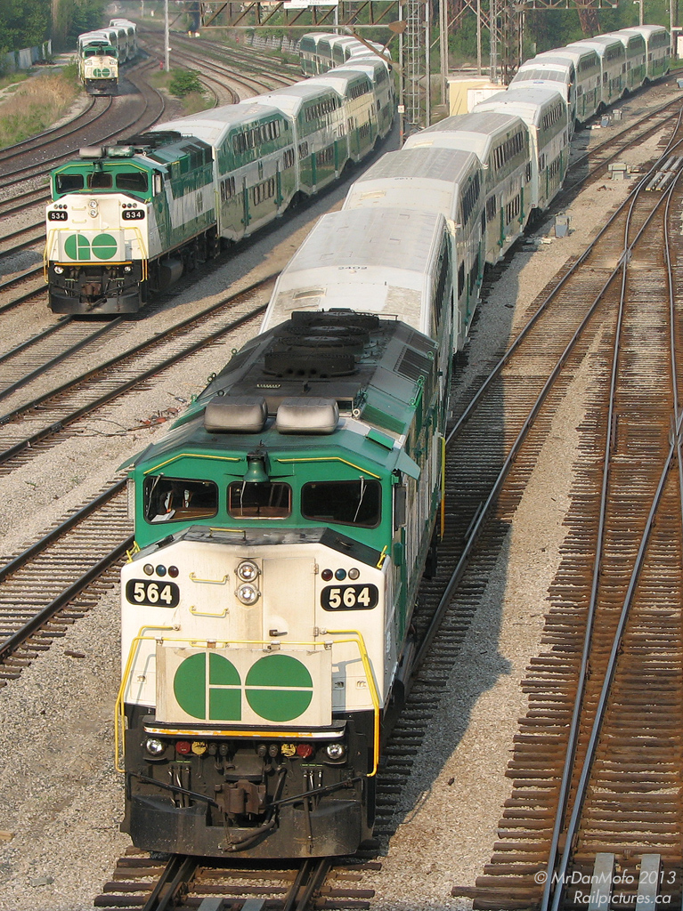 Back when the F59PH ruled GO Transit, there was no sleek new MP40PH-3C, no rush to shoot the entire 45 unit F59 fleet, nor was there actually any excitement in shooting one: they were on everything. On this sunny May day back in 2007, we find the carefully executed ballet of train movements in and out of Union Station at Bathurst St., with each one sporting an F59. GO 564 arrives inbound on Milton line train #156, while 534 departs for Willowbrook with Lakeshore line equipment move 472. In the background on the bypass tracks, 543 also waits to head to Willowbrook with equipment from Milton line train 152.

A year later, the new MP40's would be making inroads on many of these trains. 5 years later, and one would actually be excited to catch one of the 8 remaining F59's amidst the fleet of 57 new MP40's. The torch has been passed, but the ballet at Bathurst Street continues.