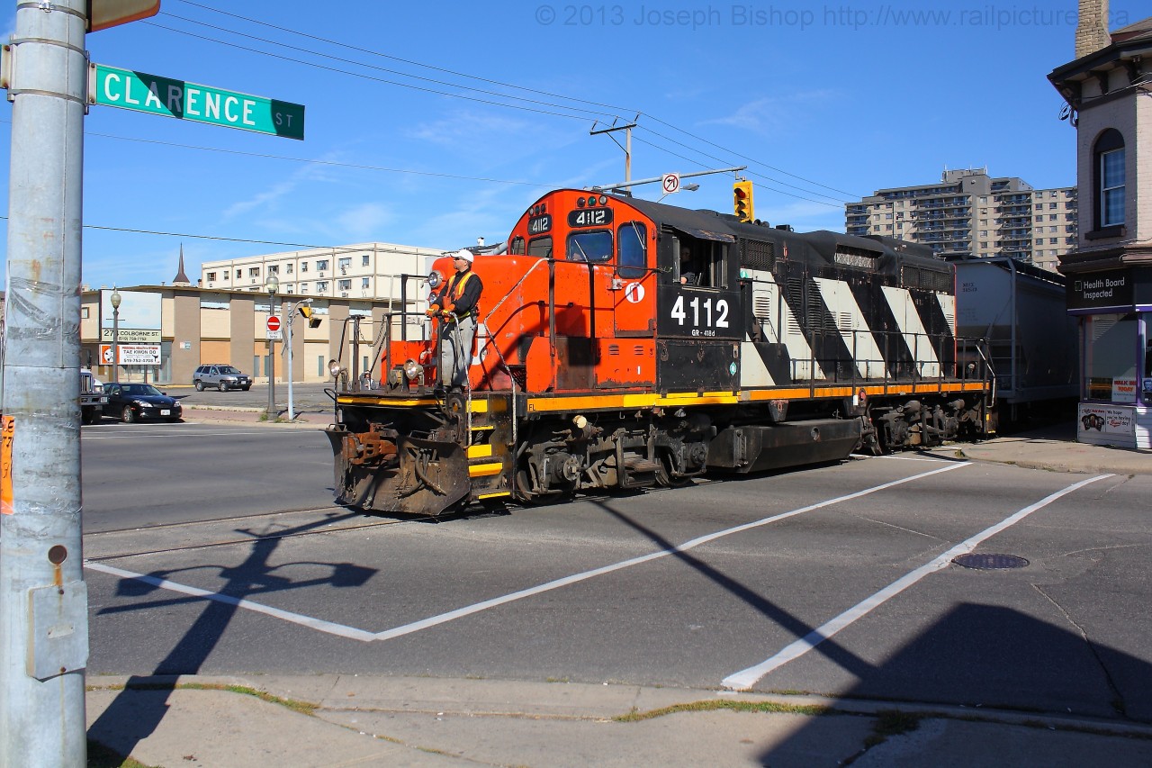 CN 4112 crosses over Colbourne Street in downtown Brantford.  They are running on the CN Burford Spur and are currently on Clarence Street on the Street Running portion of the Burford Spur.  Last week CN released a notice stating its intentions to discontinue its service on the Burford Spur.  If by November 21, 2013 nobody has expressed interest in the line, the line will be offered to the government and if no one shows interest in it, service will cease to exist.   Hopefully this isn't my last time shooting 580 on the Burford Spur..