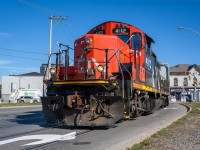 CN 4112 negotiates its way through downtown Brantford on the CN Burford Spur.  They are about to exit the street running portion of the spur and continue down to Ingenia.  <br> Thanks to Ryan Gaynor with helping to edit this image.