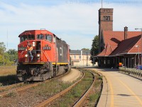 CN 435 rolls into Brantford with CN 2435 leading the way past the station.