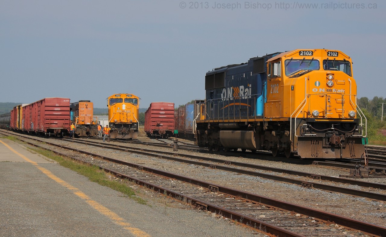 ONT 2102 has cut off of ONT 1730 and will be parked on a yard track for use as the yard switcher for the duration of today.  ONT 2103 will then move into position and couple to ONT 1730 and ONT 2101 to power Northbound train 214 back to North Bay.