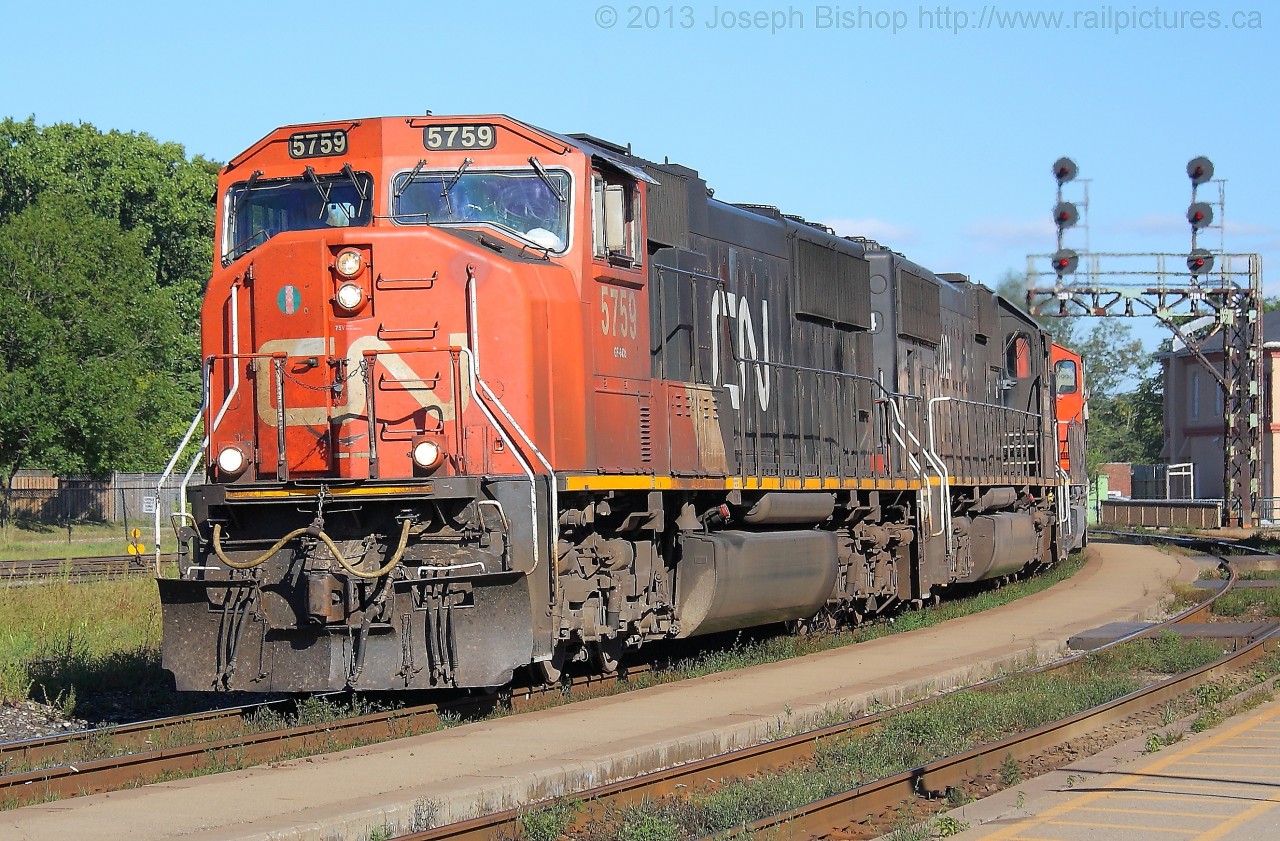 CN 435 slows in preparation for their set off in the yard at Brantford.  CN 5759, IC 1024 and CN 5638 are in charge of 435 on this day.