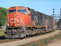 CN 435 slows in preparation for their set off in the yard at Brantford.  CN 5759, IC 1024 and CN 5638 are in charge of 435 on this day.