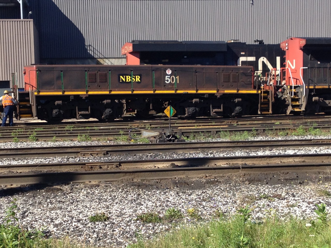 CN HBU-4 3 501 relettered for NBSR is being inspected along with NSBR  yard slug #268 for departure on train 376. The units are slated to be dropped of in St John's