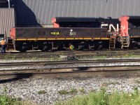 CN HBU-4 3 501 relettered for NBSR is being inspected along with NSBR  yard slug #268 for departure on train 376. The units are slated to be dropped of in St John's 