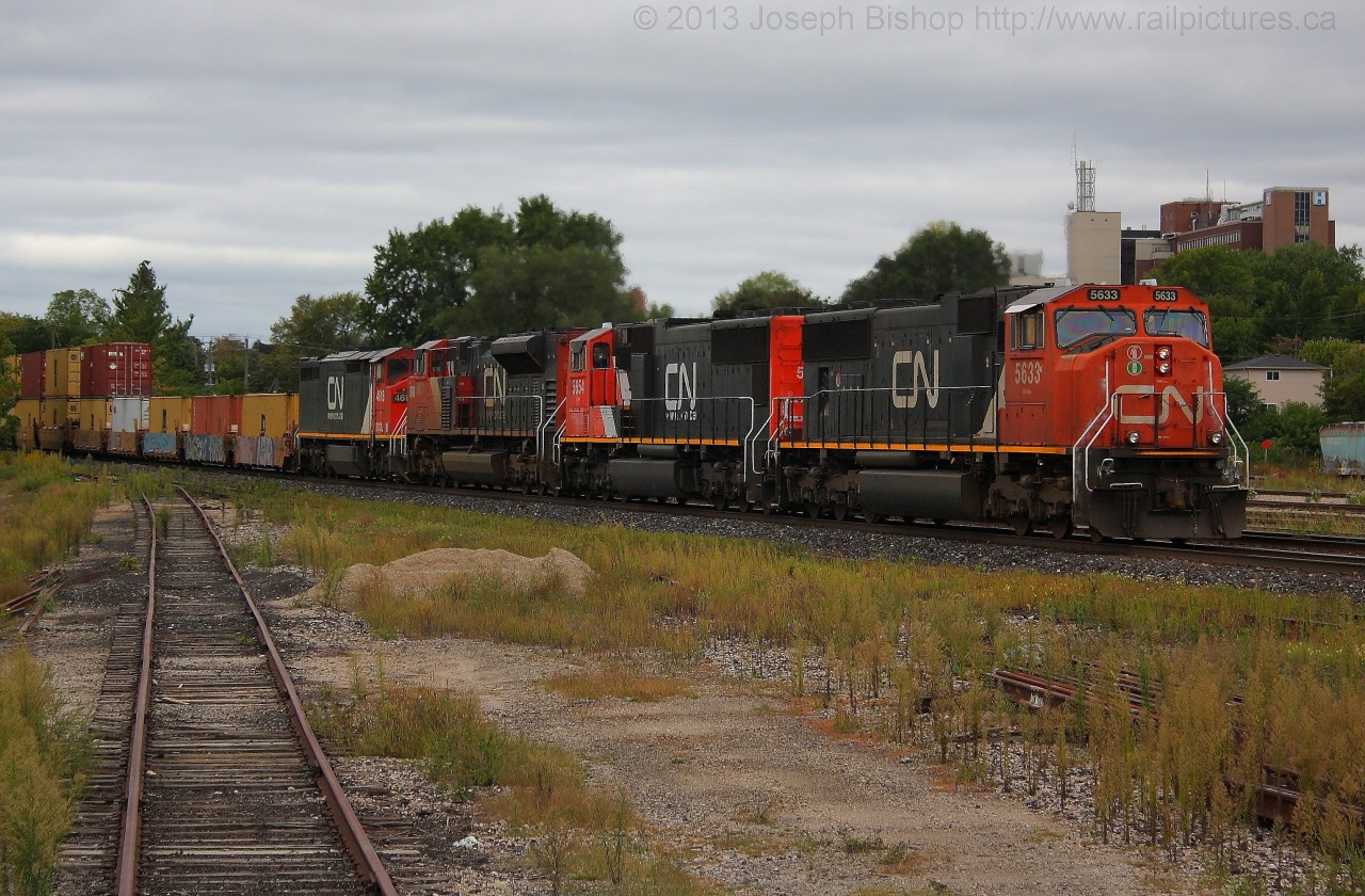 CN 394 rolls by the yard at Brantford with a four unit consist including BCOL 4618 which has been repainted into  CN colours.