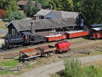 Aerial view of the station area.  Not quite! photo taken from the fire lookout tower, which happens to give a good "lookout" over the station area.  1910 built 36" gauge Vulcan Locomotive Works Class C-6, 0-4-0 ST #25 sits with her train waiting the next run.