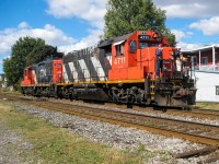 CN 4711 and CN 7275 are about to cross over St-Ambroise Street in the St-Henri neighbourhood of Montreal. They will leave the Montreal sub to head east along the Lachine Canal on the East Side Canal Bank Track (also known as the South Bank Branch) to serve the last client on the line (Horizon Milling, producer of Robin Hood Flour). For more train photos, check out http://www.flickr.com/photos/mtlwestrailfan/