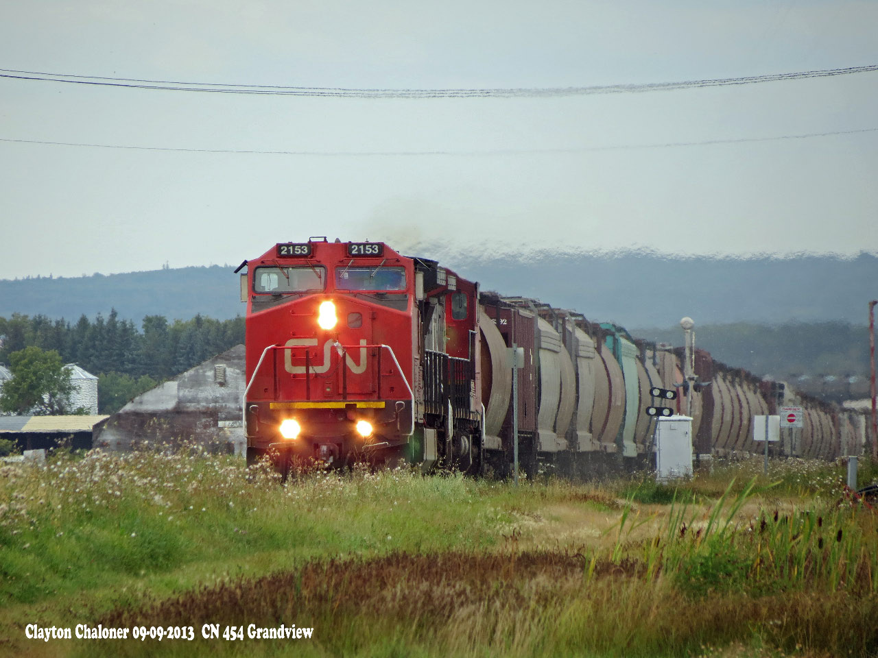 CN 454 at Grandview, MB. with 109 cars. Consist 50 grain hopper cars, 54 tank cars, 15 boxcars. hopper car
3 gondolas. East.