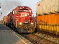 <b>Double SD40-2's.</b> CP 5746 & CP 5790 head west through Dorval at sunset after holding for two eastbounds. For more train photos, check out http://www.flickr.com/photos/mtlwestrailfan/