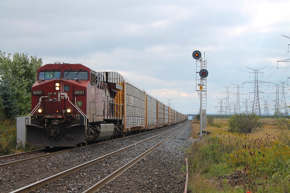 CP 8531 leads the 2-240 on the south track going eastbound at Hornby East or Lisgar station. Default yellow on the north track but just as this train passed a CP 143 got a restricted proceed on the north because 2 trains (147 & 247) are waiting ahead by Guelph junction for this 240 to pass. Just before this train appeared, you can see the end of the stopped autoracker of the stopped 247 at Hornby and the 147 was stopped in Milton West. This was a good day with about 10 trains for about the 9 hours i was there. Good Birthday celebration.