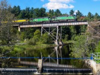 A quartet of GE C30-7's leads this train eastwards over the ex-CP Eastman trestle on a gorgeous fall day. Power is MMA 5023, MMA 5017, MMA 3609 & MMA 3000. For more train photos, check out http://www.flickr.com/photos/mtlwestrailfan/