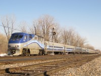 <b> AMT Mishmash.</b> In 2009 we see 3 AMT trains laying over for the weekend at Delson. The equipment comes from such disparate sources as CN (a GP9), NJT (GP40FH-2 and cars), GO Transit (cars) on top of equipment built new for the AMT (F59PHI and cars). From the front, we first see AMT 1325 (F59PHI) with 3 700 series AMT cars and 1 leased NJT car. Next is AMT 1310 (GP9), generator car 604 and 4-ex GO tranist 'Go Karts'. Last is AMT 4140 (a GP40FH-2 on lease from NJT) and 3 700 series AMT cars mixed with 2 leased NJT cars. Unfortunately AMT trains no longer lay over here on weekends. The new location is not easily photographable like this one.