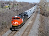 CN 8021 leads a westbound through Beaconsfield, with the help of CN 2242 (a GE ES44DC) mid-train. Unlike most CN SD70M-2's, the 25 SD70M-2's in the 8000 class have a high mounted headlight. This is because they were an add on to a Norfolk Southern order and so were built to NS specs. In the background can be seen CP's parallel Vaudreuil Sub. For more train photos, check out http://www.flickr.com/photos/mtlwestrailfan/