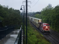 A CP intermodal heads east at Rosedale in some damp conditions. 