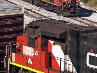Workhorses converge in the same frame at MacMillan Yard. GP38 #7504 shoves a large cut of outbound cars into the Halton traffic bowl while GP9RM #7265 and it's faithful slug companion take a breather just shy of the secondary hump's southern yard ladder.