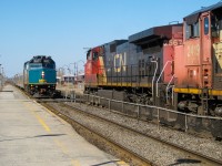 VIA 6407 pulls into Dorval to make its station stop and is about to pass a stopped CN westbound that had just got a new crew (not a very common occurrence). The CN westbound is powered by CN 2567, CN 2419 and CN 2515 (the last out of sight) For more train photos, check out http://www.flickr.com/photos/mtlwestrailfan/