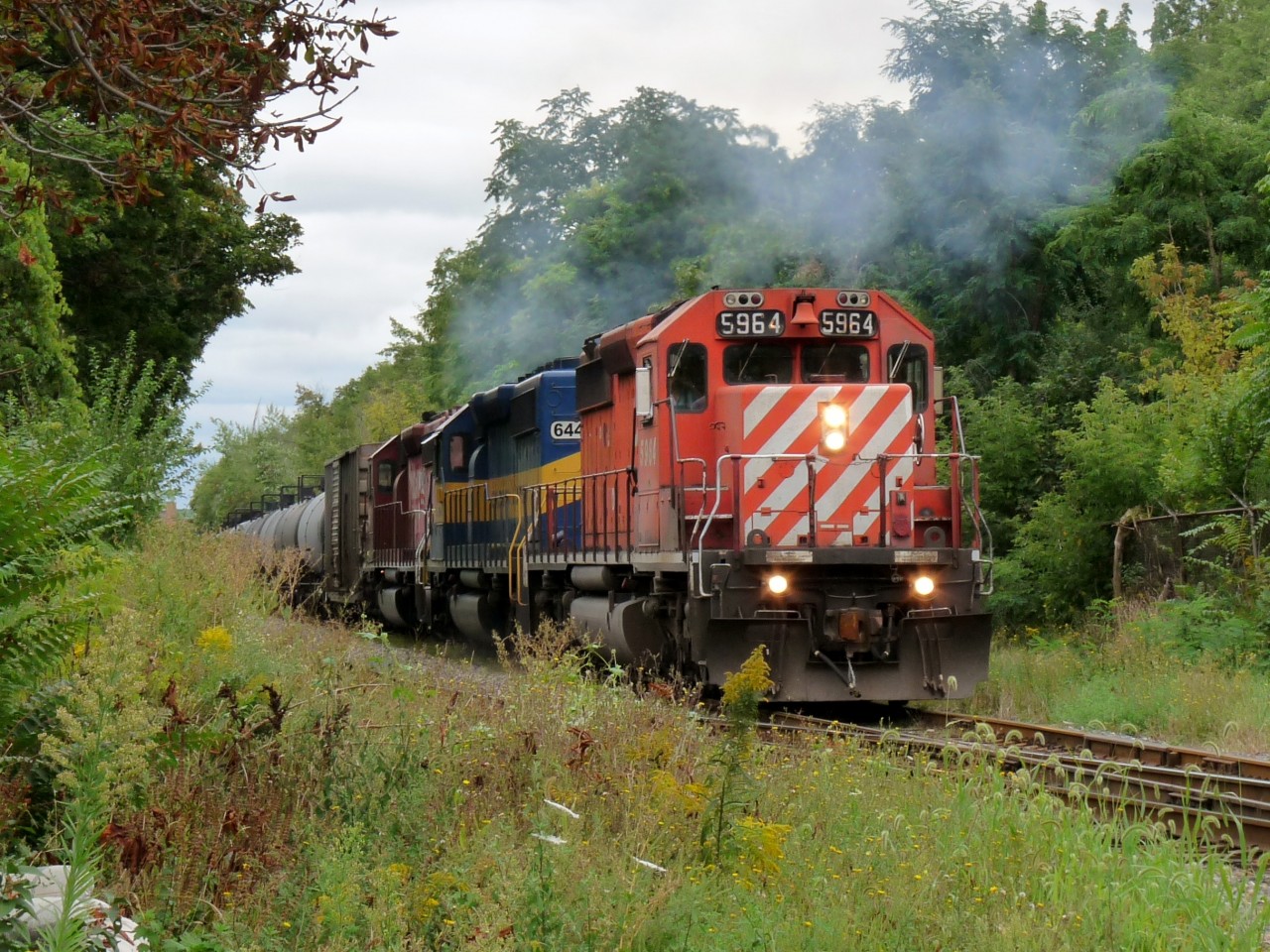 Three SD40-2's including ICE 6443 "City of Bellevue" are the power for the ethanol train as it heads west through Hamilton on Friday afternoon.