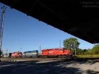 Train 640 rolls by Woodstock CP Station with a triplet of new and old EMD power - (photo taken at 20mm on 35mm digital)