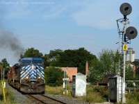 We're at the Hamilton mileboard, train 246 (South) is about to pass the Northward block signal indicating advance to begin/end CTC Park, and will take the south siding (just behind photographer) at Kinnear for a crew change and work. The consist today was CEFX 1051, CP 9662, CP 5879, CP 5969, CP 8233. 8233 was set off at Kinnear.