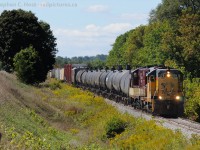 <b>Chessie</b> system lives!.. albeit very faded, as unrebuilt, unmodified GP9 175 and GP7 378, both sporting unchopped hoods (as nature, uhh, EMD intended) haul over 50 cars to the CPR interchange yard at Woodstock Ontario.<br><br>I was quite glad the F units weren't on the train today, froth levels were low to non existent ;)