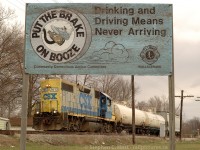 CSXT Train D924 (Sarnia, ON to Dresden Turn) with GP38-2 2613 is running long hood forward through Wallaceburg on the old C&O Canadian Division. With two cars for liquid air at Sombra 12 miles to the north and work recently completed at Tupperville (5 cars) and Wallaceburg (single car into the old Libbys glass plant) the long meandering day has a couple hours remaining for the crew. A friendly reminder to "put the brake on booze" as the sign says :)

